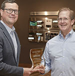 Microchip Technology presented Gentex with a plaque commemorating the delivery of its 25 billionth MCU.